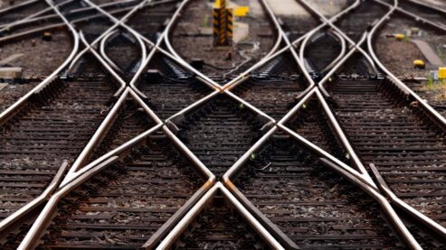 intersecting railroad tracks at a switch point in a railyard
